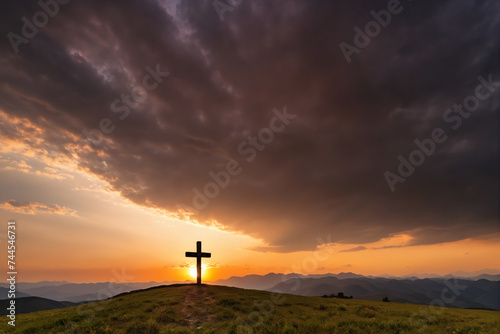 Sunset behind cross in epic landscape