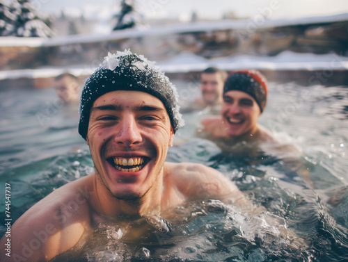 A man bathes in ice water in winter 