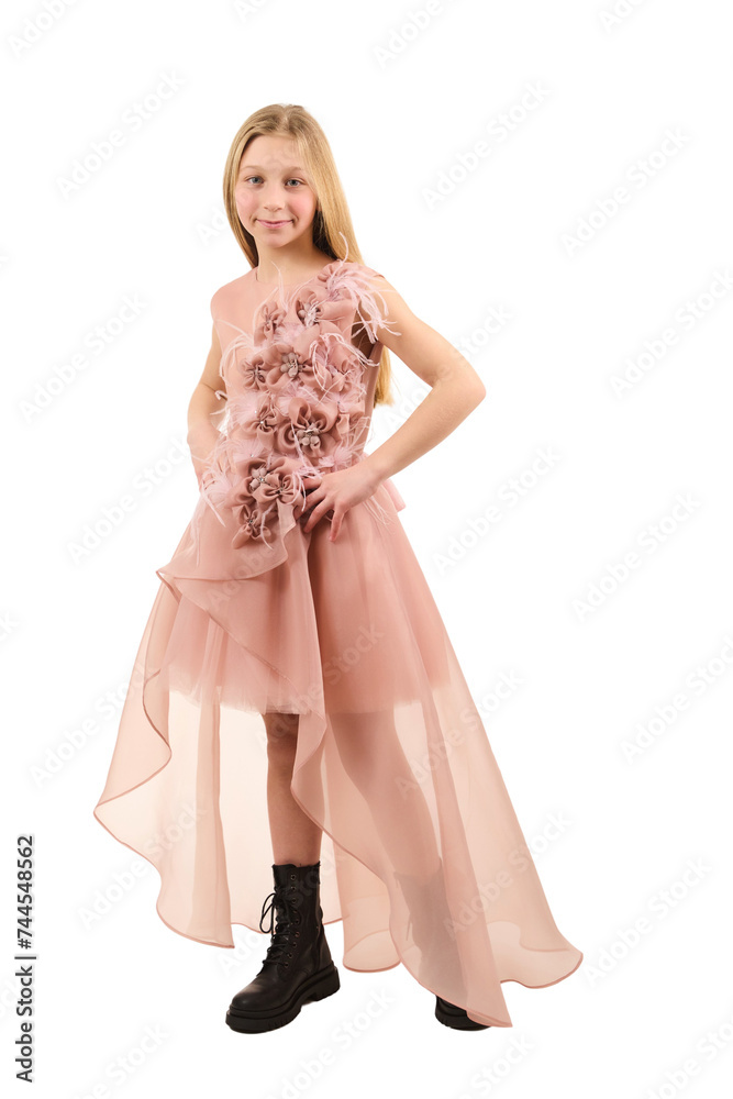 Young girl posing in elegant pink dress