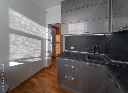 KItchen in the modern flat. Light from the window.