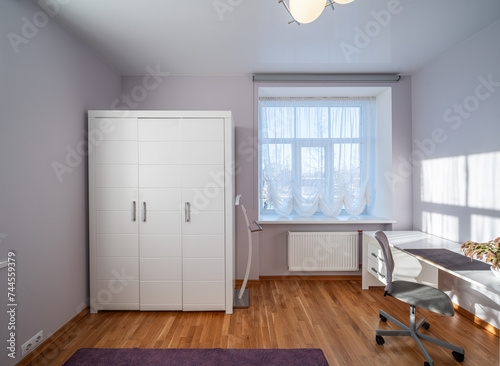 Living room in the modern flat. Lighti from th ewindow.