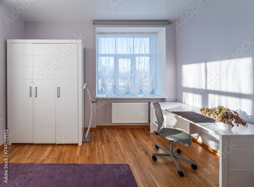 Living room in the modern flat. Lighti from th ewindow.