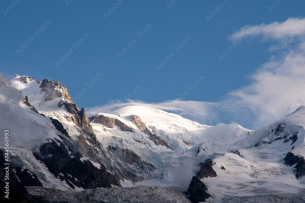 Obraz premium Summit of Mont Blanc (4808 m), the highest mountain in the Alps, against blue sky in summer, Chamonix, Auvergne-Rhone-Alpes, Haute-Savoie, France