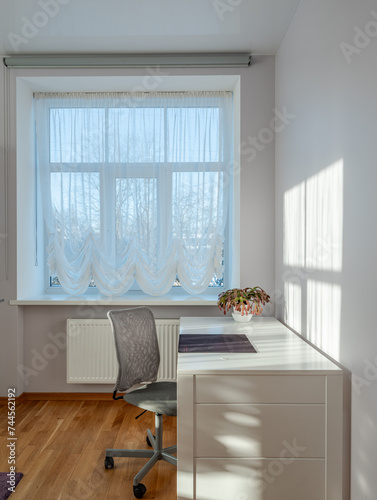 Living room in the modern flat. Lighti from th ewindow.