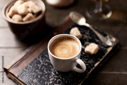 Cup of coffee on wooden background. Close up.