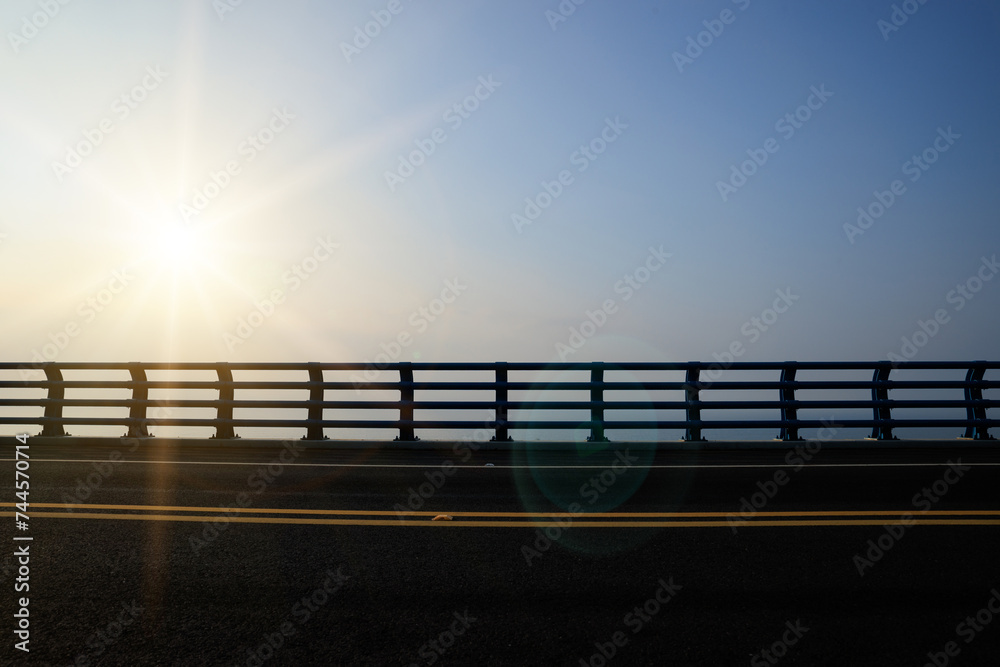 Sunrise over seaside bridge landscape