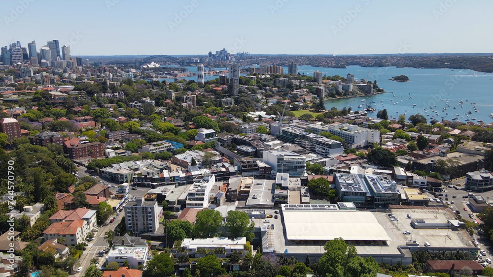Aerial drone view of homes and streets above the harbourside suburb of Double Bay in east Sydney, NSW Australia looking toward Sydney Harbour on a sunny day