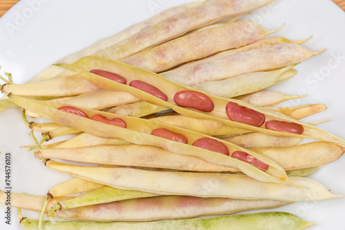 Open pods of young kidney beans on same whole pods