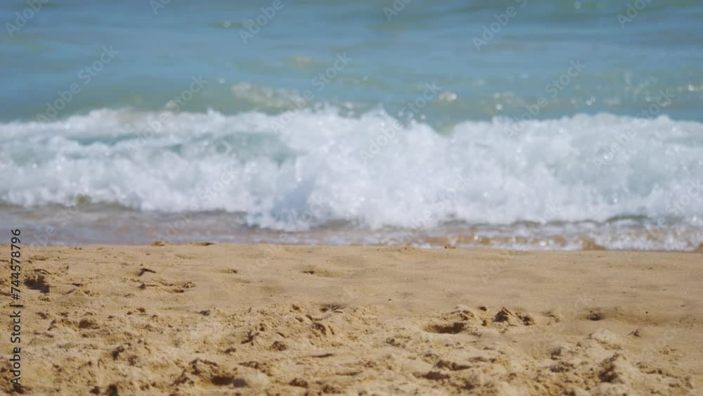 Seashore with waves gently washing over sand in 4k slow motion 120fps Seashore with waves gently washing over sand in 4k slow motion 120fps