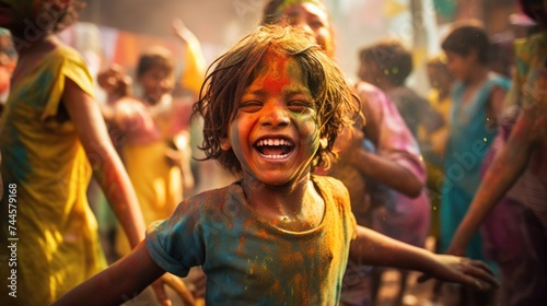 Happy people celebrating holi. the child laughs and throws paint and multi-colored powder. holy holiday in india © Svetlana
