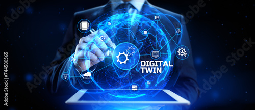 Digital twin industrial technology and manufacturing automation technology. Businessman pressing virtual button.