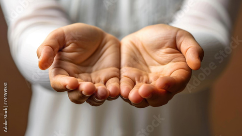 Close-up of person holding out their hands, versatile image for various concepts photo