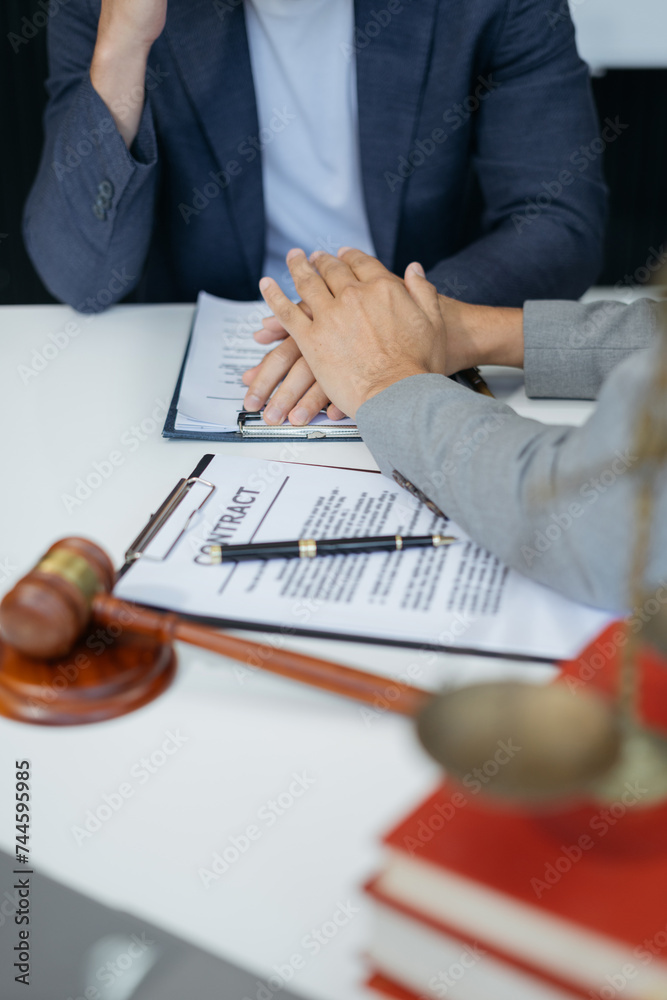 Obraz premium Lawyer comforts his clients with legal advice and serious stress trust commitment for justice issues and lawyer concepts...