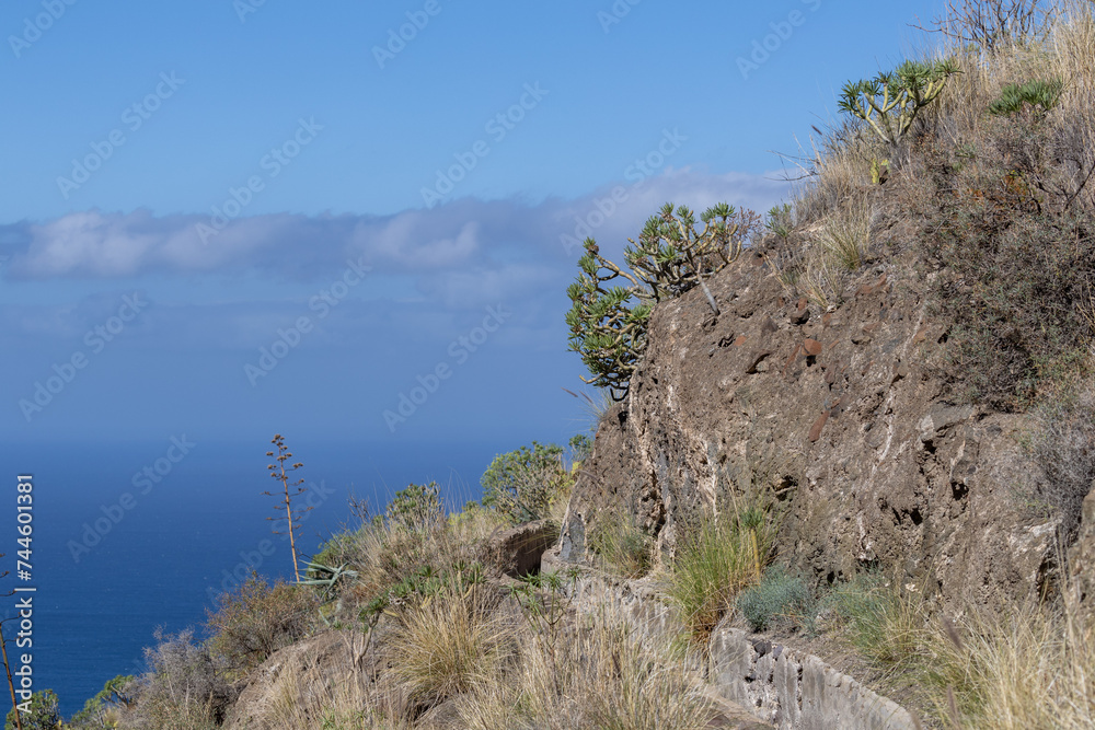 Rain water drain channel also used as hiking route in the hills above Agaete, Puerto de las Nieves, Gran Canaria, Spain.