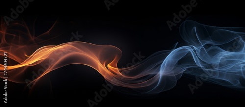 Creative abstract composition with swirling shades of blue, pink, red, orange and lilac colorful smoke on a dark background