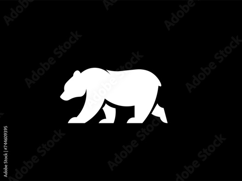 Vector illustration of a silhouette of a polar bear on a black background