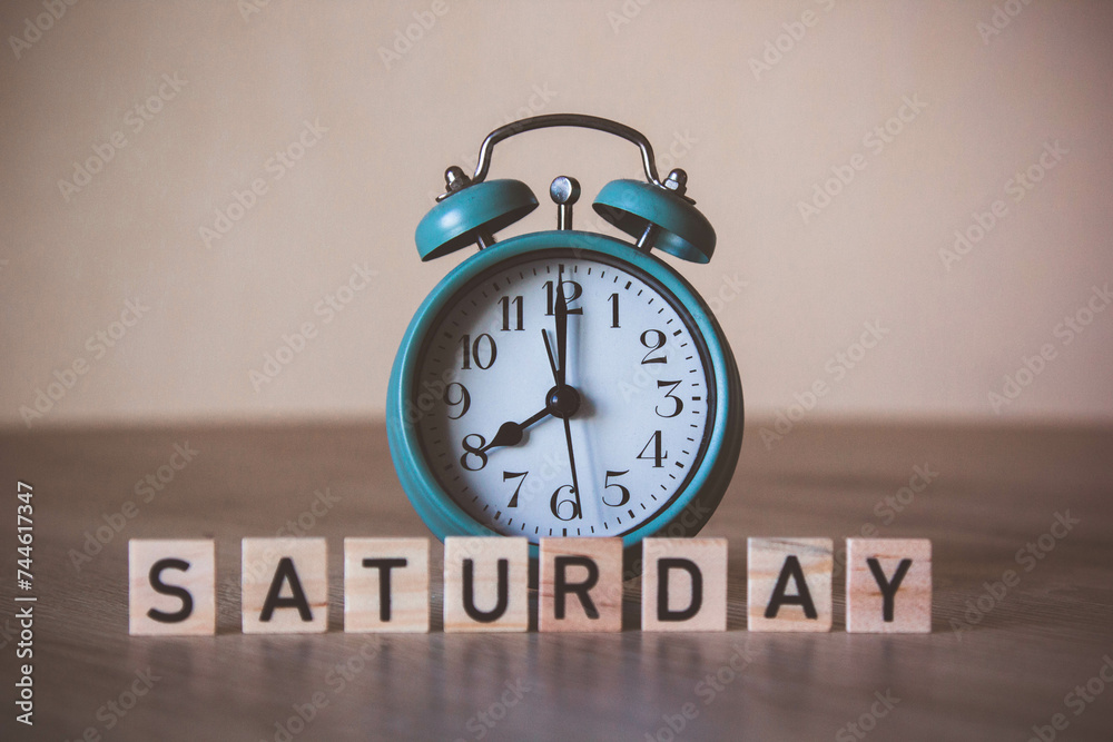 alarm-clock with saturday letters. saturday meeting. daily meeting. plan for saturday. saturday workday. vintage alarm-clock. Retro style. time management concept. Daily plan concept alarm-clock with saturday letters. saturday meeting. daily meeting. plan for saturday. saturday workday. vintage alarm-clock. Retro style. time management concept. Daily plan concept