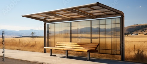 Outdoor bus stop in rural village, constructed with brown polycarbonate. photo