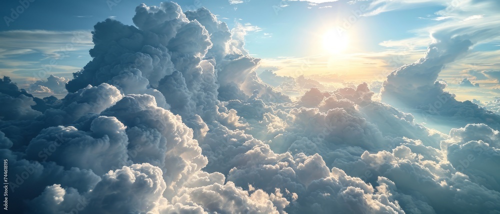 Sunburst Through Cumulus Clouds. The sun casts radiant beams of light through the dynamic shapes of cumulus clouds - obrazy, fototapety, plakaty 