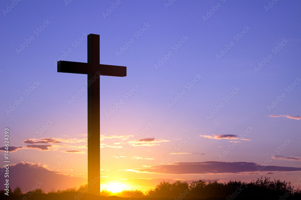 Cross against the sunset. Good Friday or Easter concept