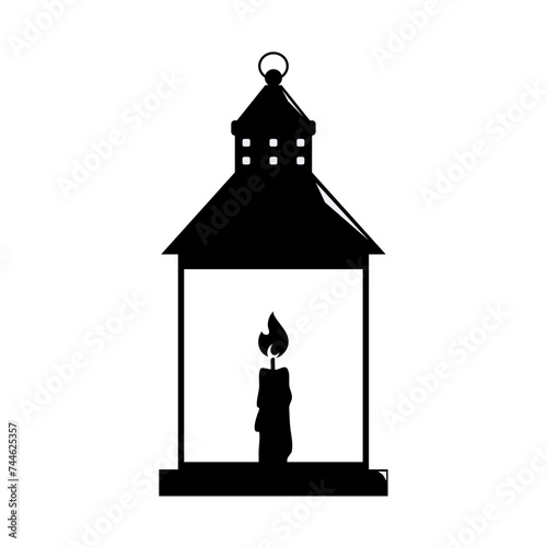 silhouette of a lantern with a burning candle