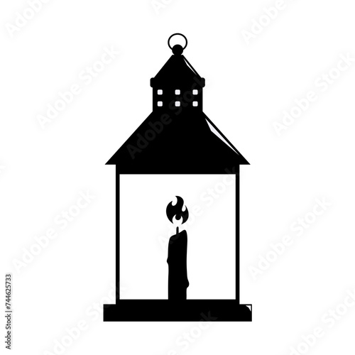 silhouette of a lantern with a burning candle