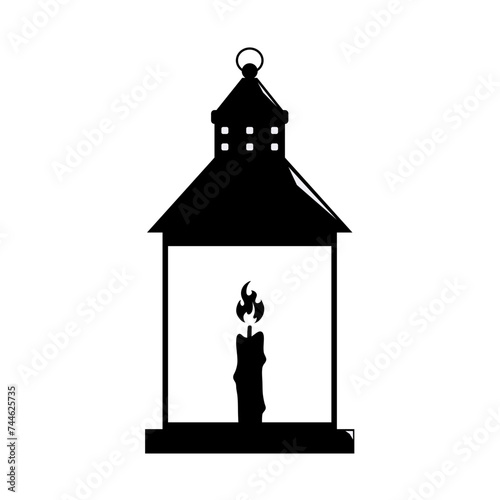 silhouette of a lantern with a burning candle