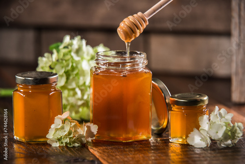 Jar of honey and flowers