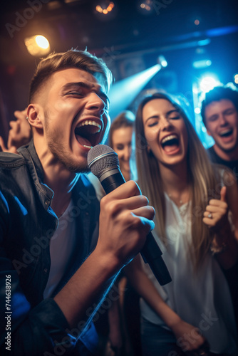Group of friends owning the stage at karaoke club.