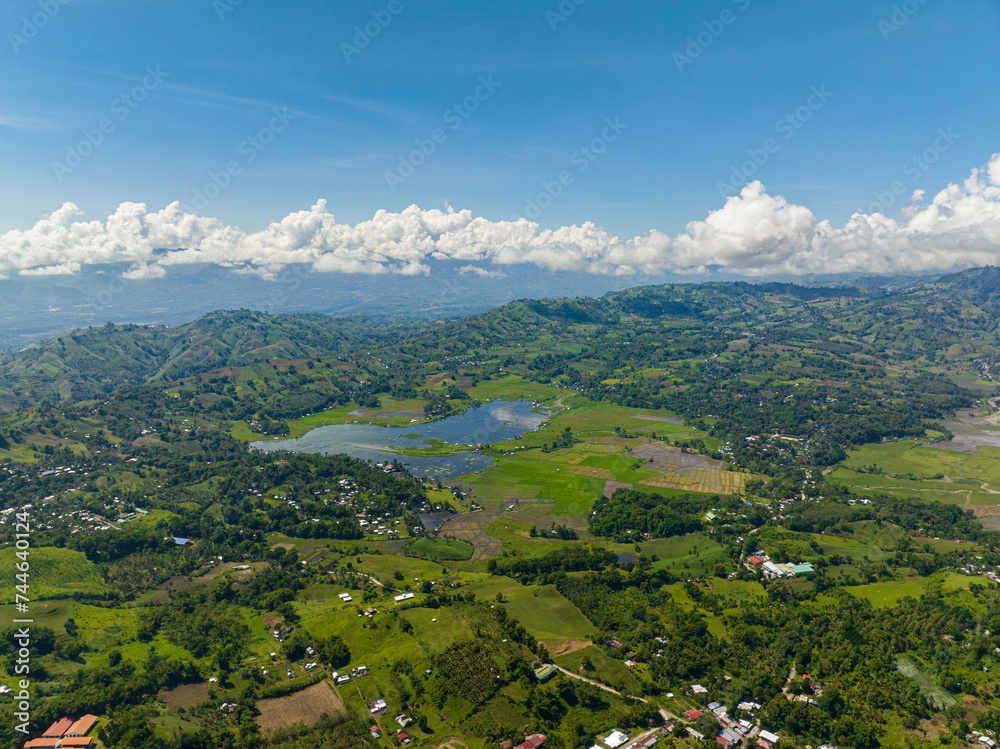 Lake Seloton surrounded by agricultural land and mountain rainforest. Lake Sebu. Mindanao, Philippines.