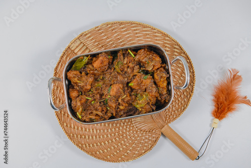 Sukha mutton or chicken, dry spicy Murgh or goat meat served hot,  mutton fry, special hot spicy traditional dish. Buffalo roast, meat pepper fry. Top view South Indian non veg food side dish Rice photo