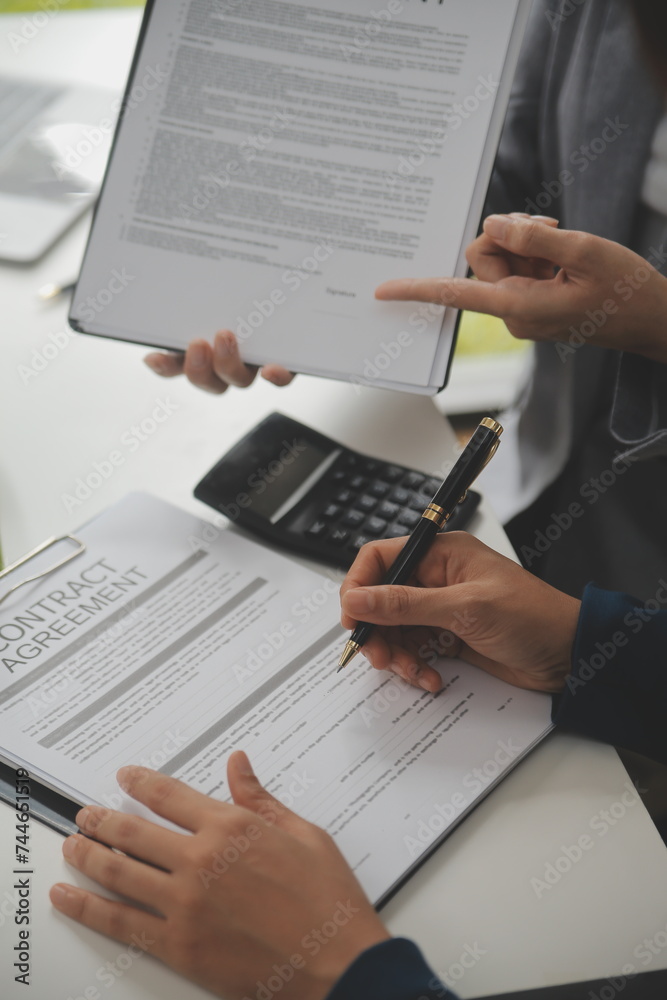 Business Signing a Contract Buy - sell house, insurance agent analyzing about home investment loan Real Estate concept. Business Signing a Contract Buy - sell house, insurance agent analyzing about home investment loan Real Estate concept.