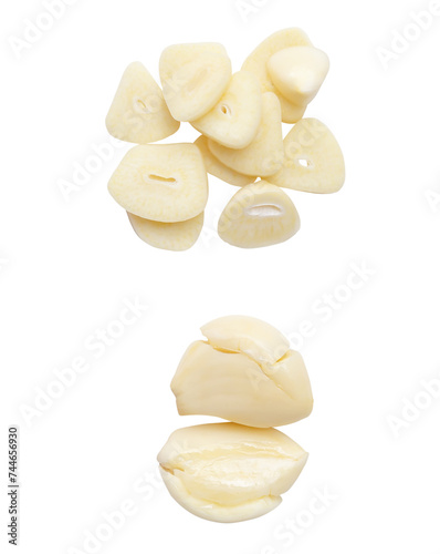 Top view set of pounded peeled garlic cloves and slices isolated with clipping path in png file format