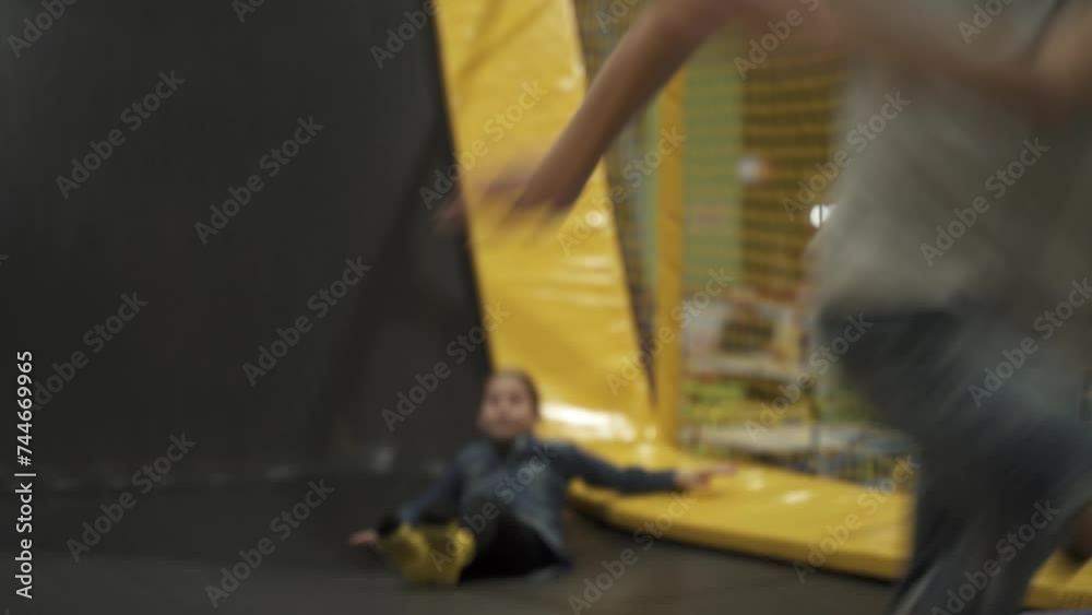 Children active leisure. Sports weekend in sports center of acrobatics and trampoline. Physical education. Children having fun on trampoline in entertainment center, childhood and sporty lifestyle. Children active leisure. Sports weekend in sports center of acrobatics and trampoline. Physical education. Children having fun on trampoline in entertainment center, childhood and sporty lifestyle.