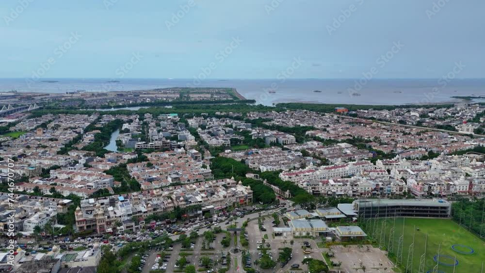 aerial view of a residential area in North Jakarta, Indonesia with a near the shore of the sea aerial view of a residential area in North Jakarta, Indonesia with a near the shore of the sea
