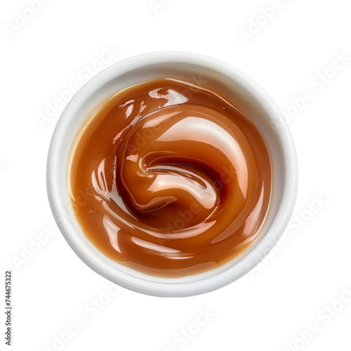 sweet caramel sauce isolated on a white background, top view. With clipping path.