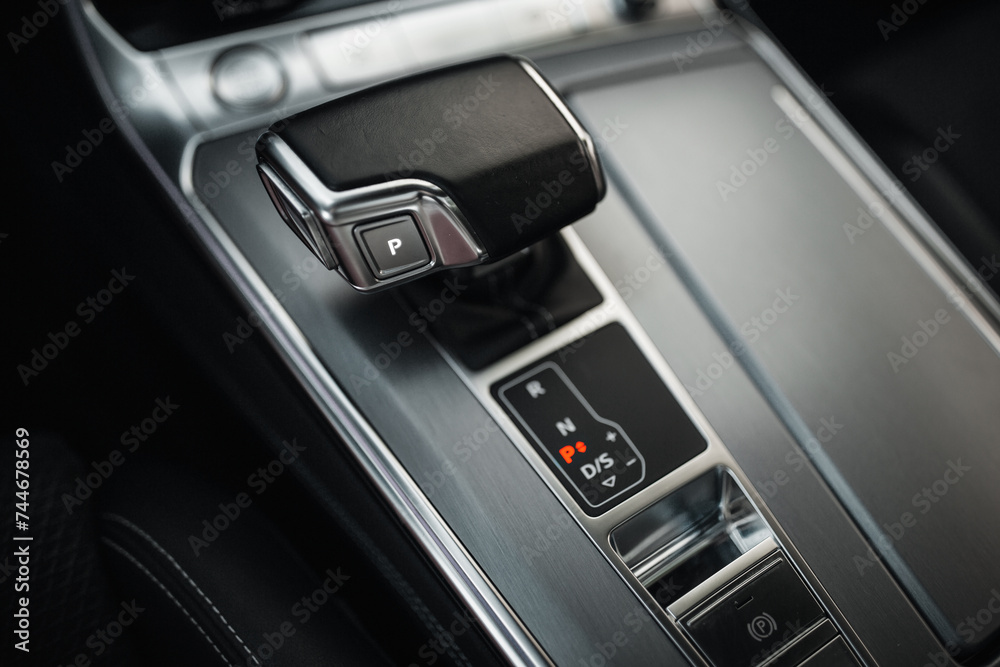 Modern and expensive car interior and gearbox shift handle 