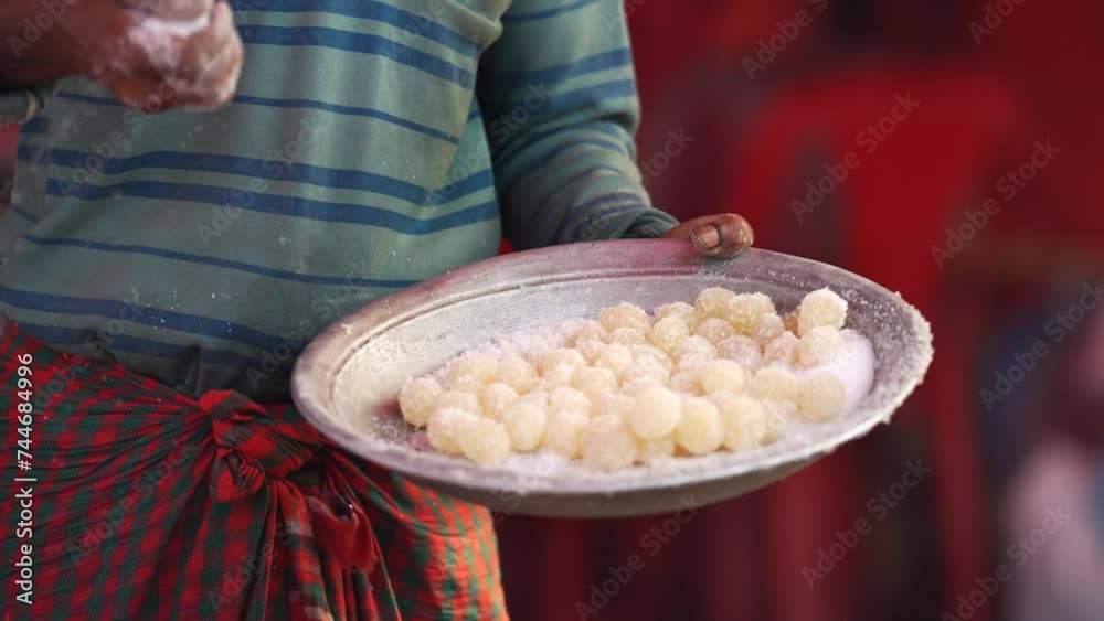 Art of making Rasgulla, a delightful Indian dessert made from milk ...