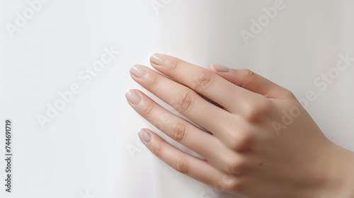 Bride s gentle hands  woman s caring touch  person s manicured fingers - a beautiful portrayal of hands  beauty  and care in this isolated spa concept image