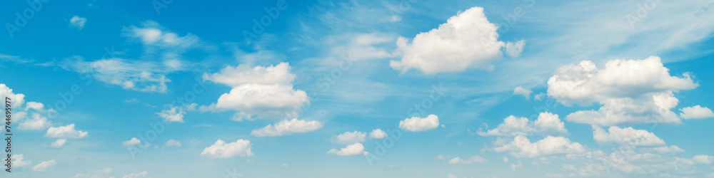 Blue sky with clouds. Cloudy sky background. Horizontal banner