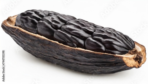 tonka bean isolated on white background with clipping path and full depth of field bean of dipteryx odorata photo