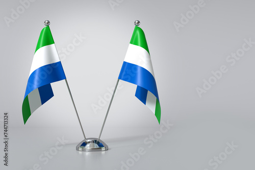 Foto Double Republic of Sierra Leone Table Flag on Gray Background