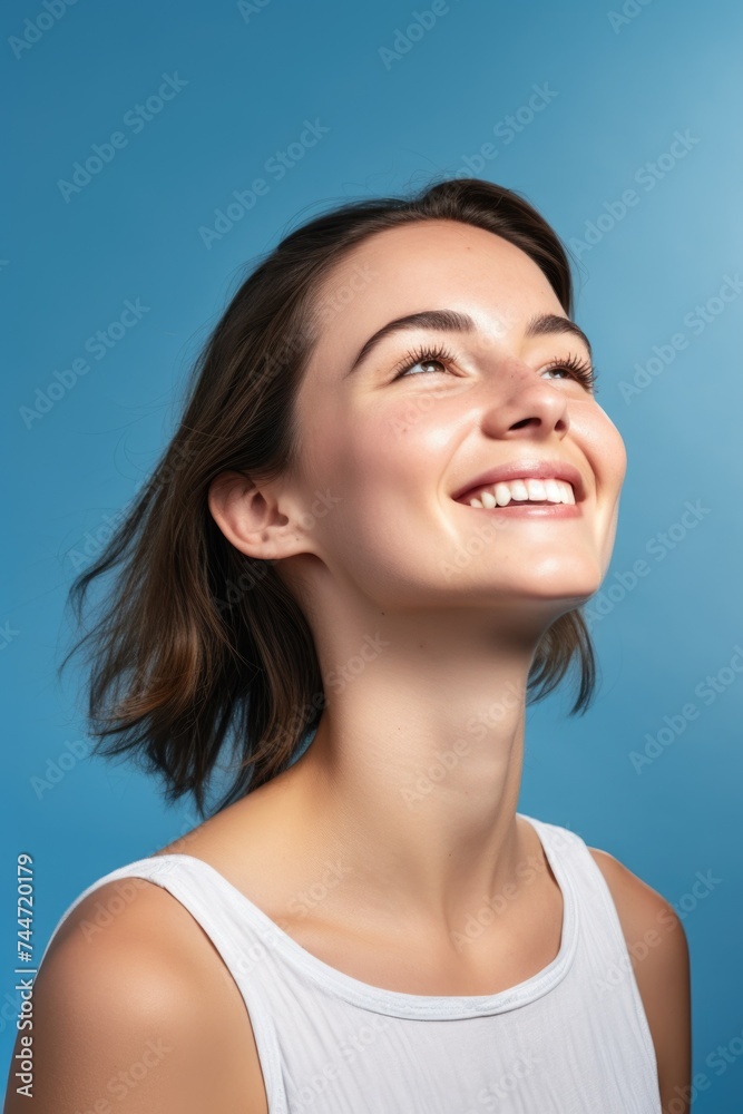 Woman smiling and gazing at the sky, suitable for various concepts and designs Woman smiling and gazing at the sky, suitable for various concepts and designs