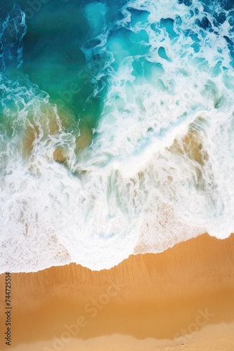 Aerial view of a beach with waves, perfect for travel websites