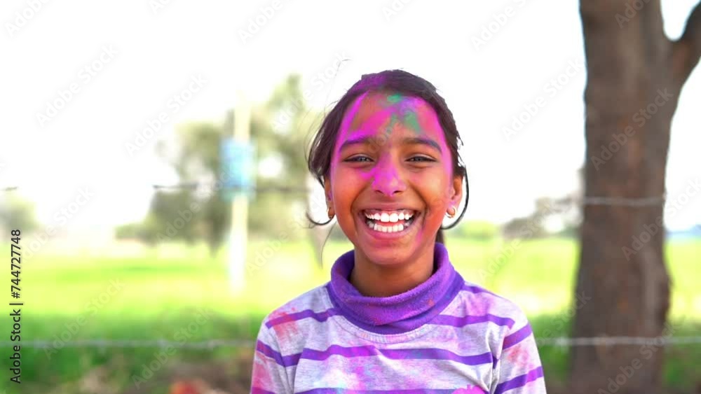 Cheerful young kids celebrating Holi festival, kids playing with colors during Holi Color festival