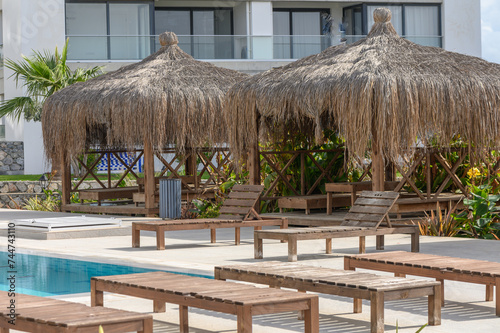 bungalows and beach chairs near the pool and cafe in Cyprus 1