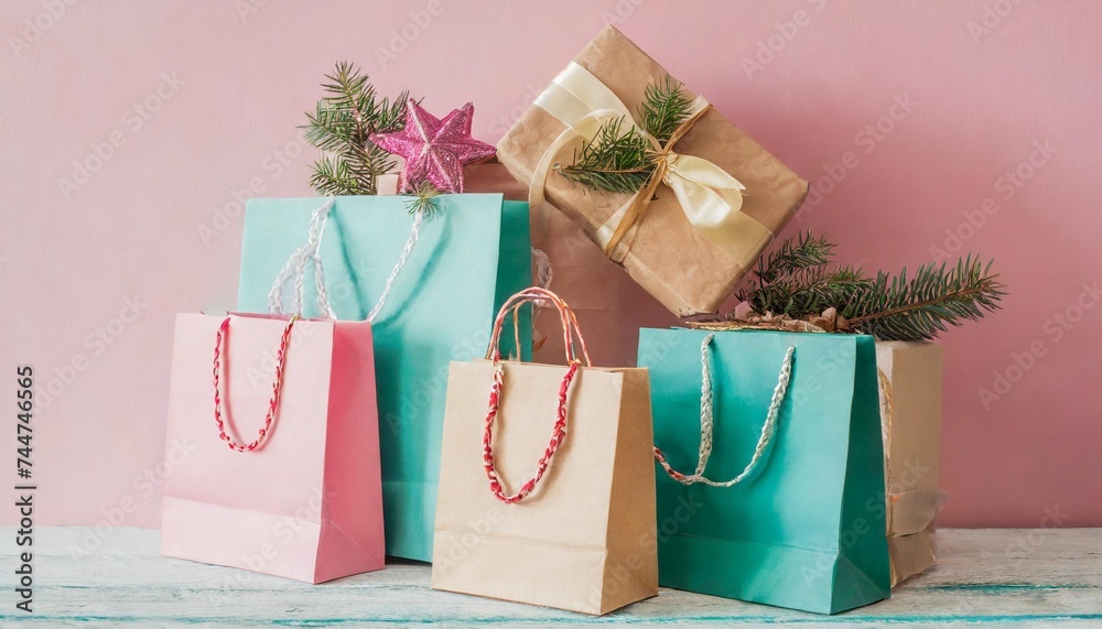 christmas gifts in shopping bags on a pink background pastel colors holiday concept - obrazy, fototapety, plakaty 