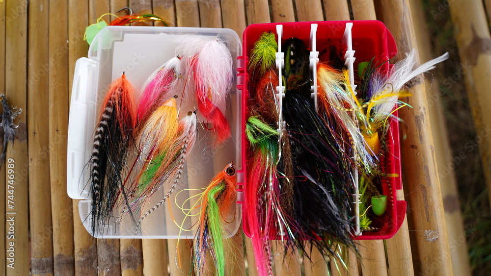 Flyfishing box full of colorful flies - short depth of field