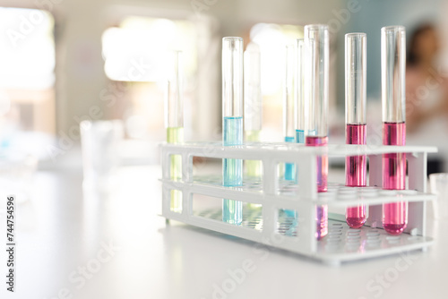Test tubes with colorful liquids in a laboratory setting photo