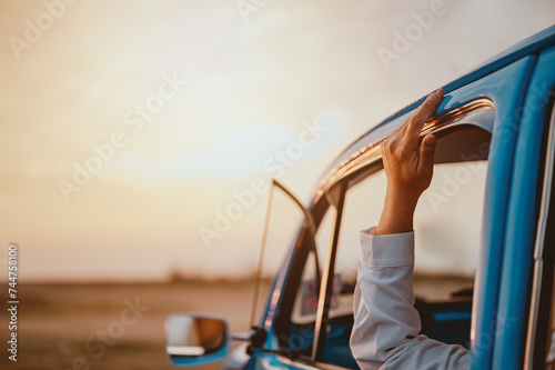 car, sunset, auto, automobile, beetle, classic, transport, transportation, sunrise, volkswagen. a volkswagen beetle in the evening sunset at grass field while the owner wave your hand in there.